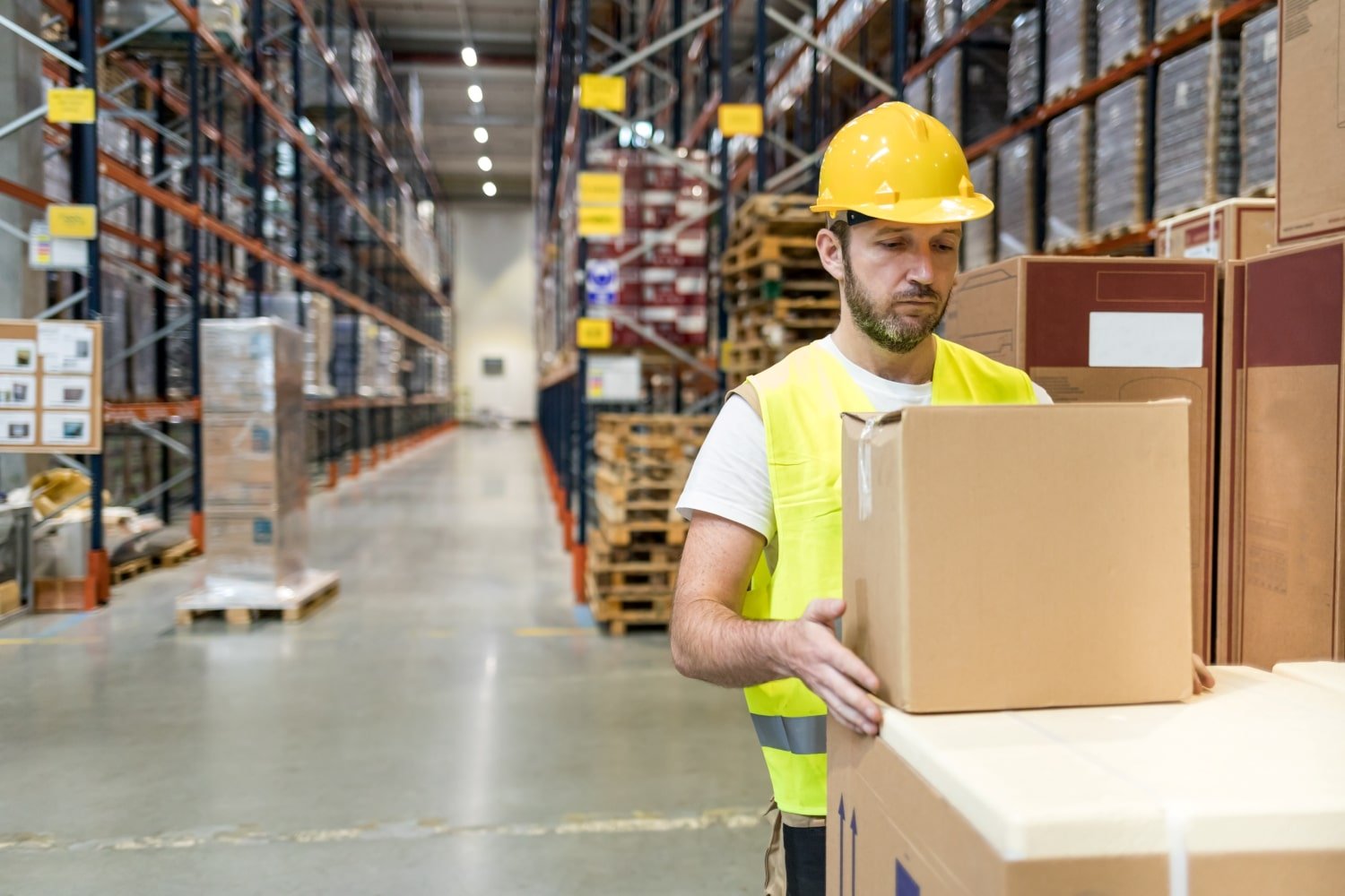 warehouse-worker-taking-package-for-delivery-to-cu-2021-08-29-22-34-35-utc-min.jpg